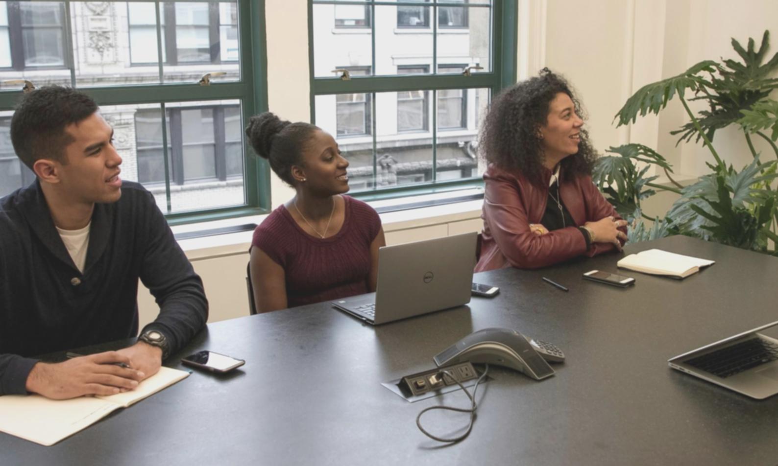 Business owner using mobile app to capture receipt in modern office setting